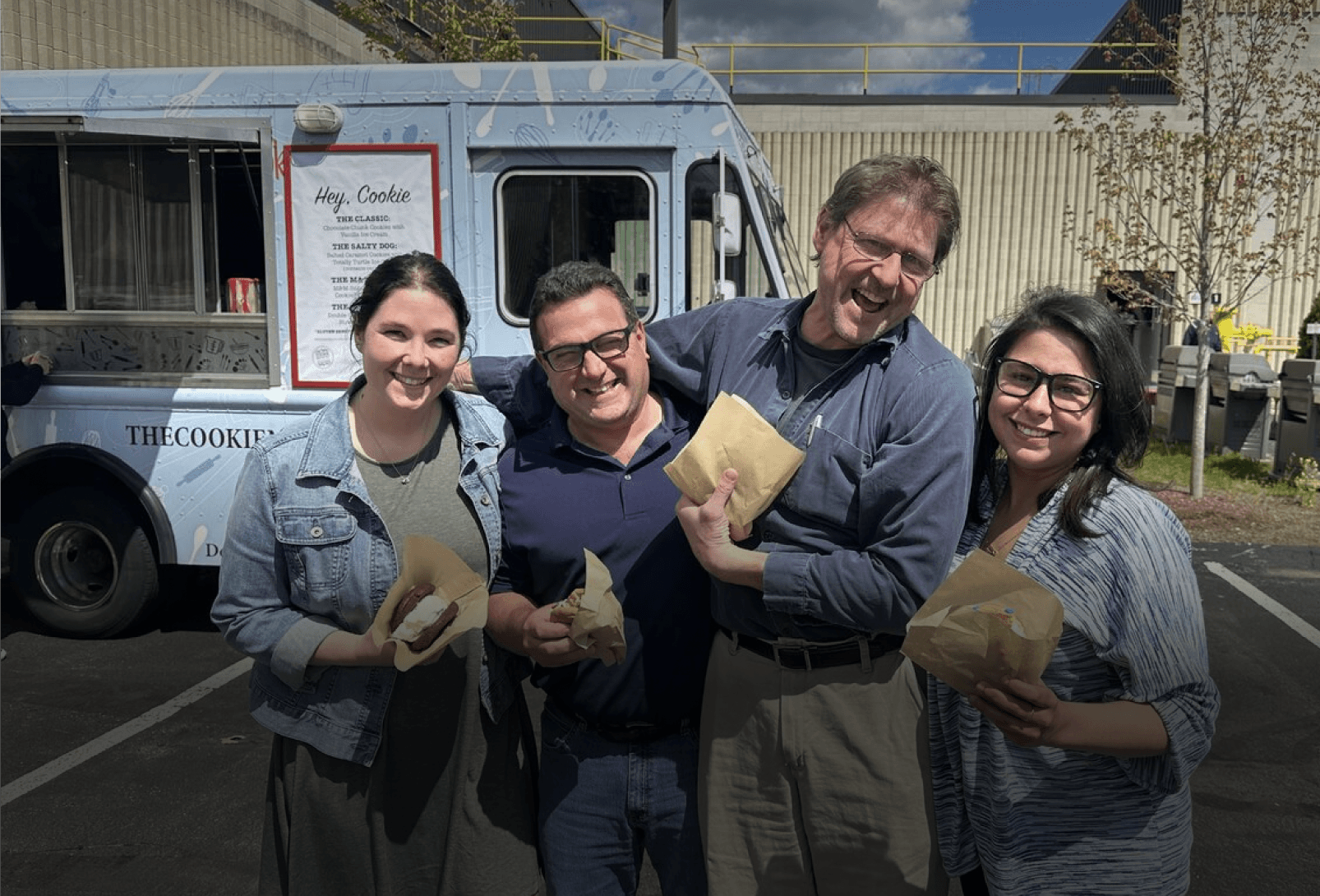 Haartz employees gathered near food truck with food